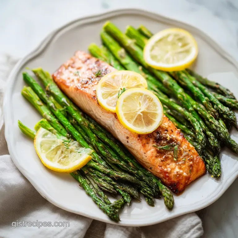 Elegant plate featuring flaky salmon fillet with lemon slice, alongside vibrant green asparagus and rosemary-roasted potat...